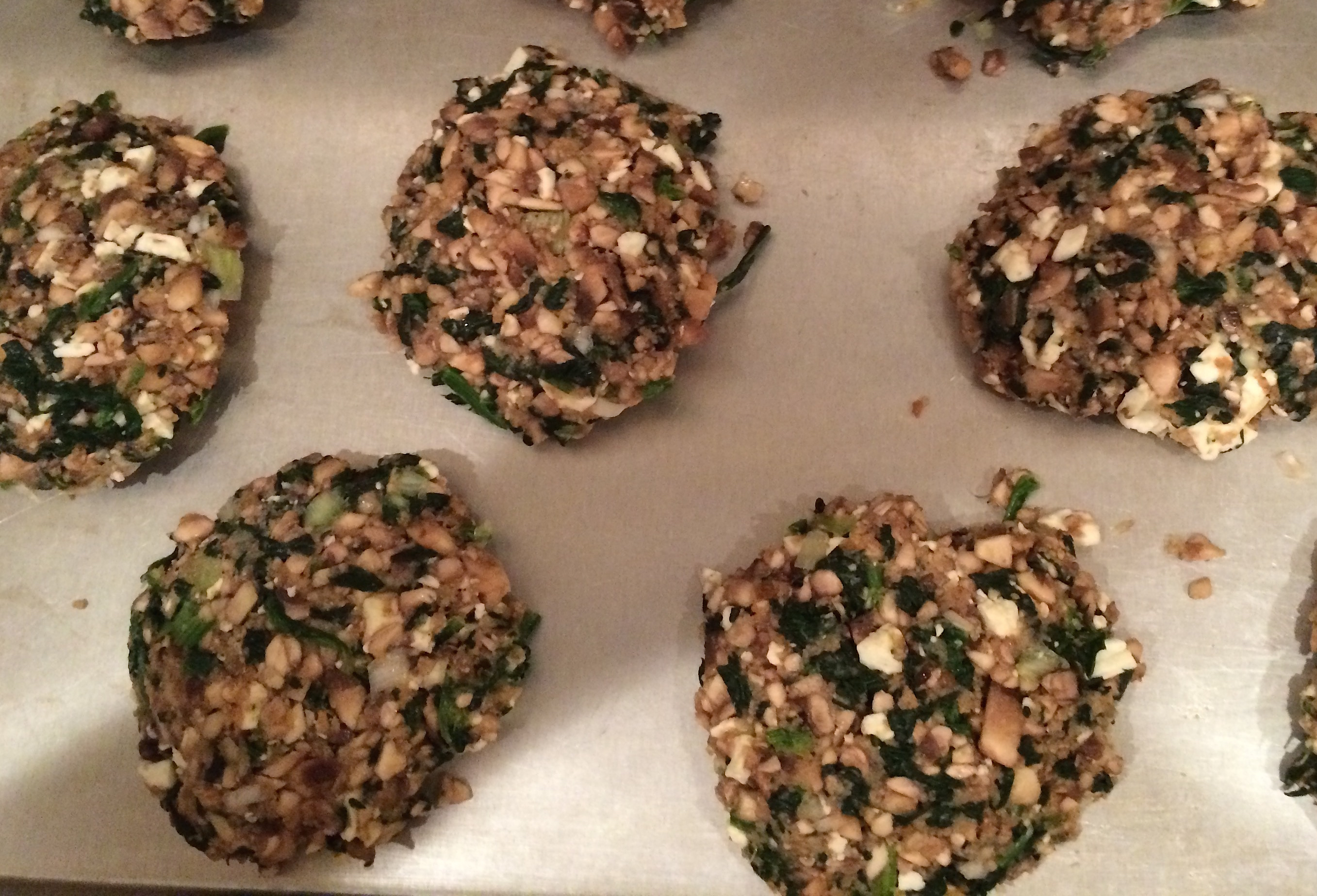 Uncooked Spinach, Mushroom and Feta patties on baking sheetIMG_2124